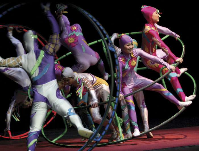 Acrobats in stunt involving large rings