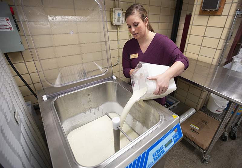 Emory Telios adds gelato base to the machine used to age the mix